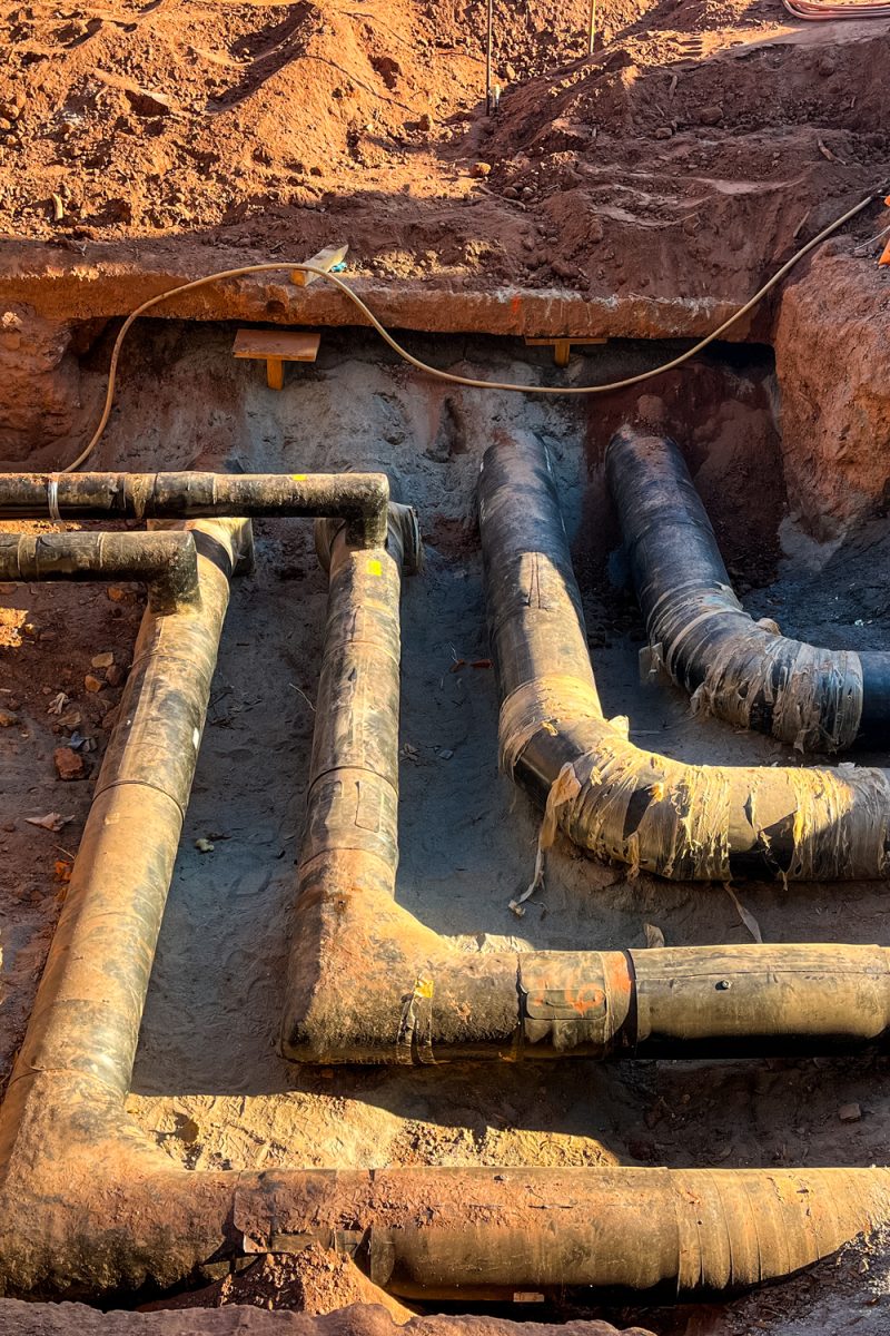 Exposed underground water pipes at construction site